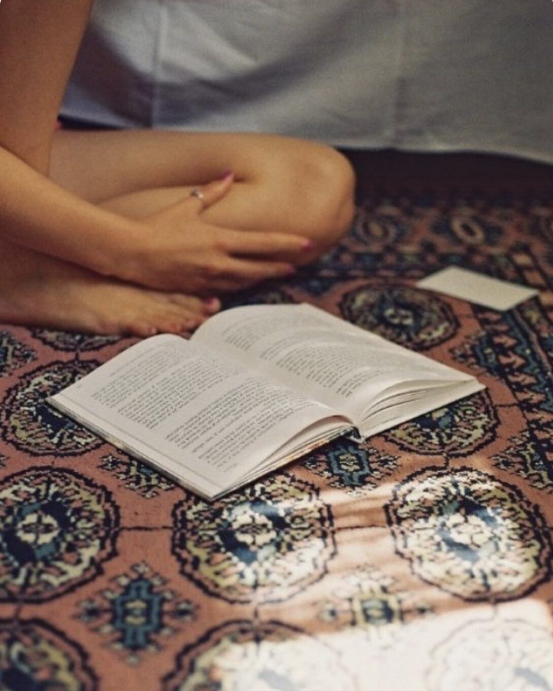 Brenna Marin practicing meditation and reading